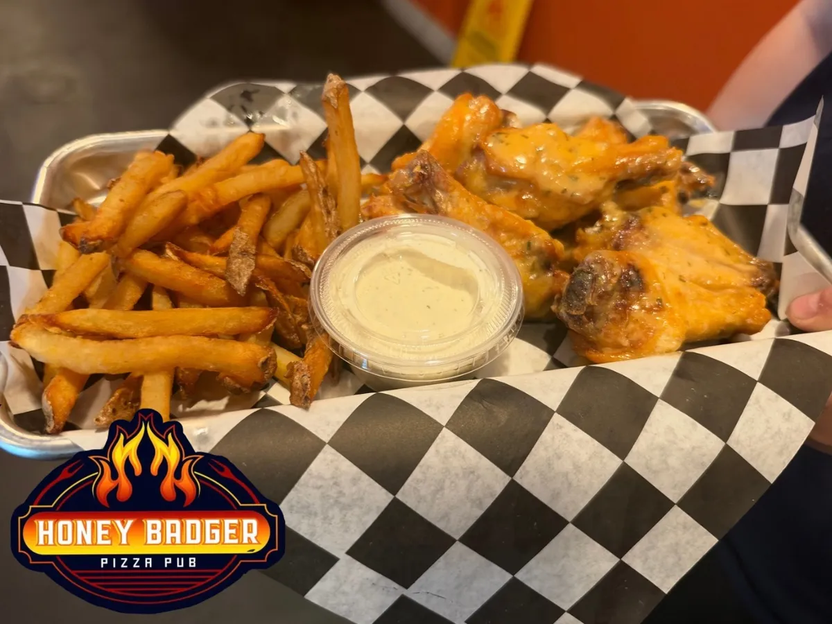 Wings and fries in a checkered basket